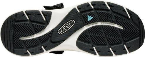 Bottom view of a shoe featuring a black and white sole with the 'KEEN' logo and a turquoise triangle detail.