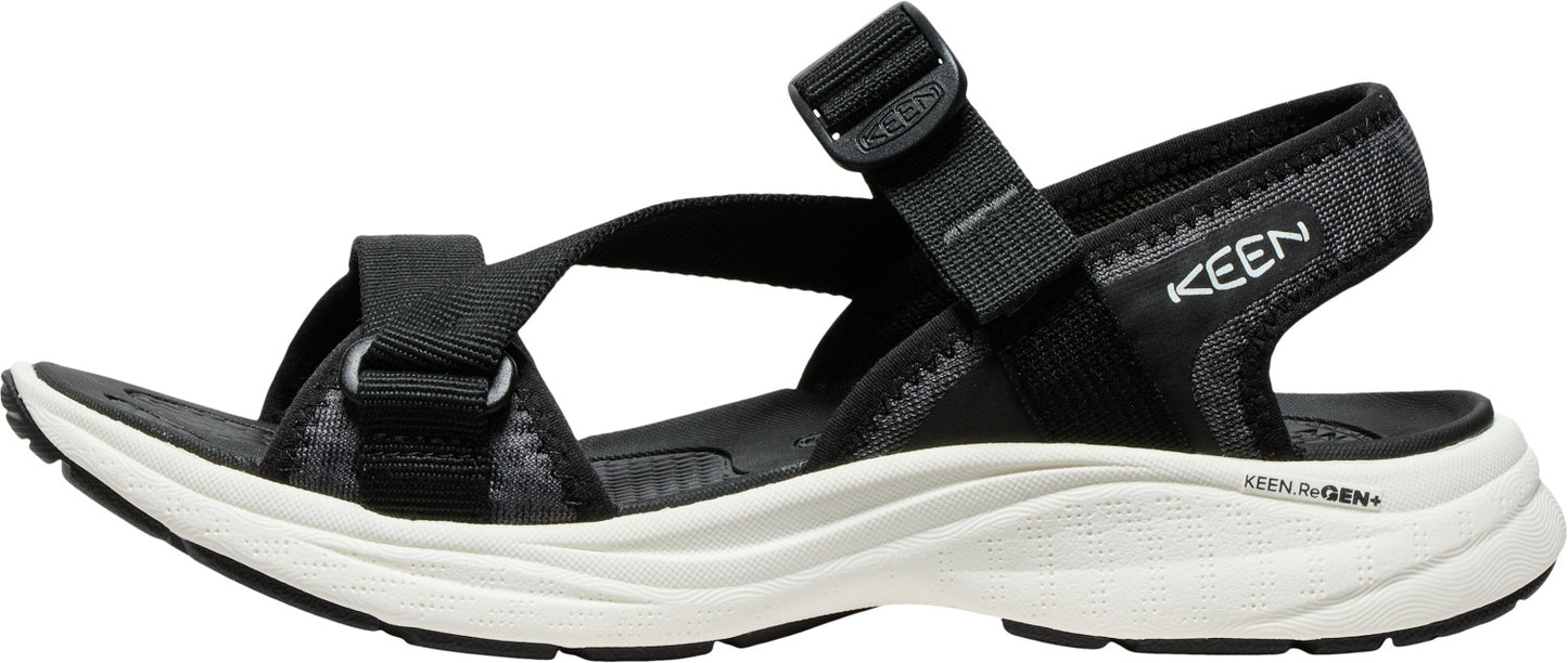A black sandal with thick straps, a white midsole, and the brand name KEEN.
