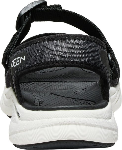 Back view of a black sandal with white sole, KEEN lettering visible on upper strap.