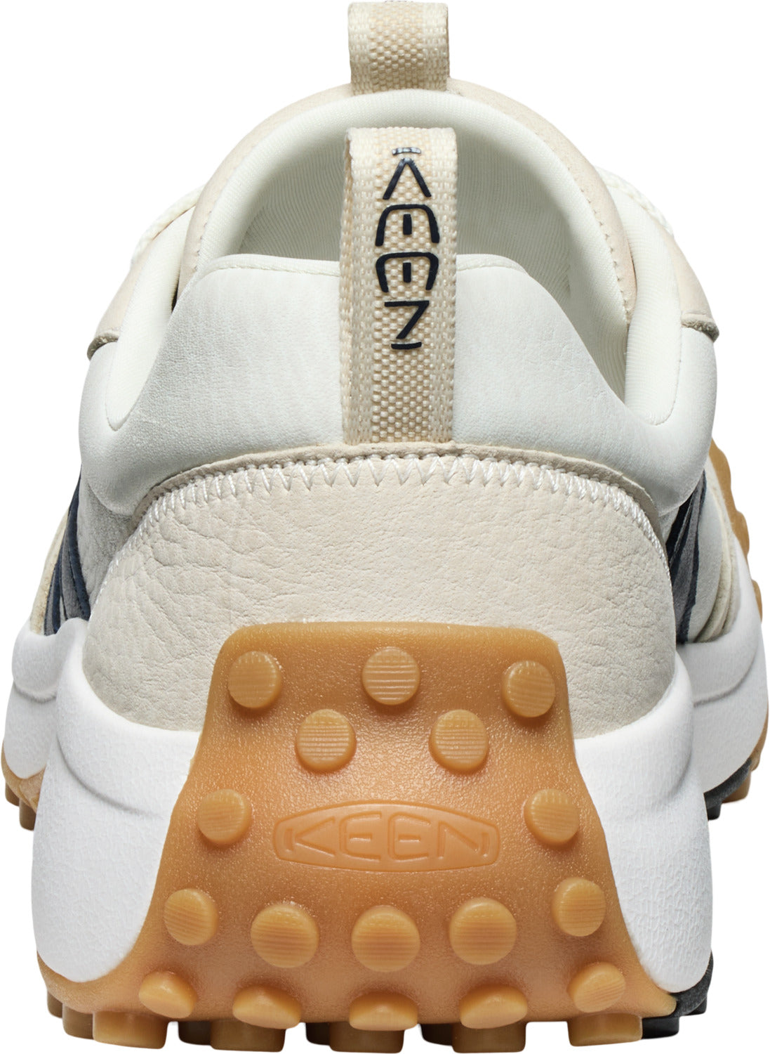 Back view of a shoe with white uppers, a thick white sole, and a brown heel tread with the word KEEN on it.