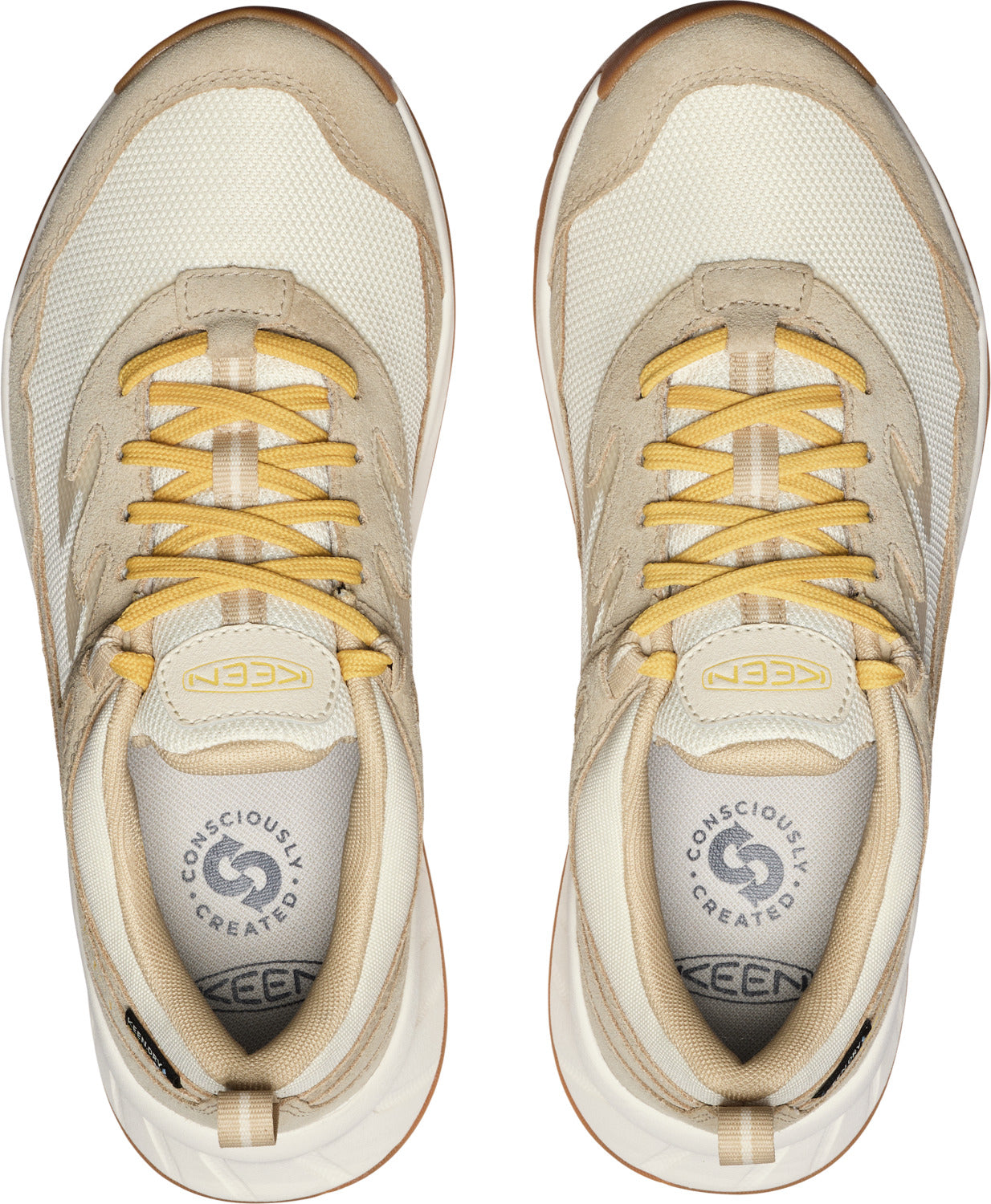 Top view of two light tan KEEN sneakers with yellow laces.