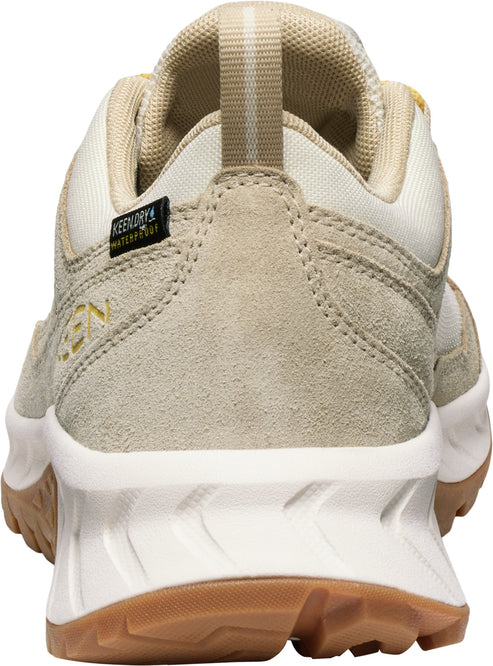 Tan suede hiking shoe with white midsole, brown outsole, and a fabric pull tab.