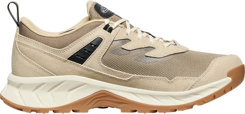 A tan running shoe with brown soles and beige laces.