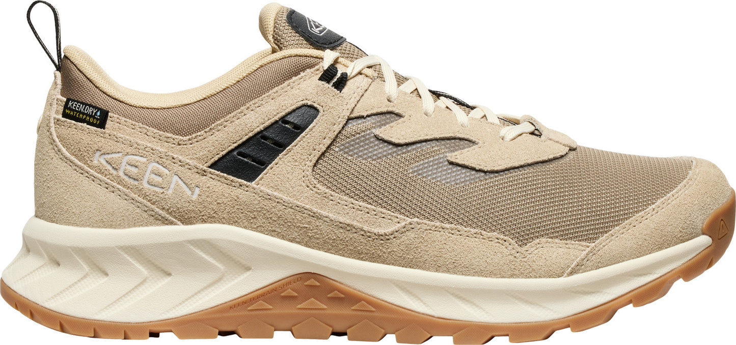 Tan sneaker with tan laces and brown sole.