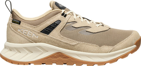 Tan sneaker with tan laces and brown sole.