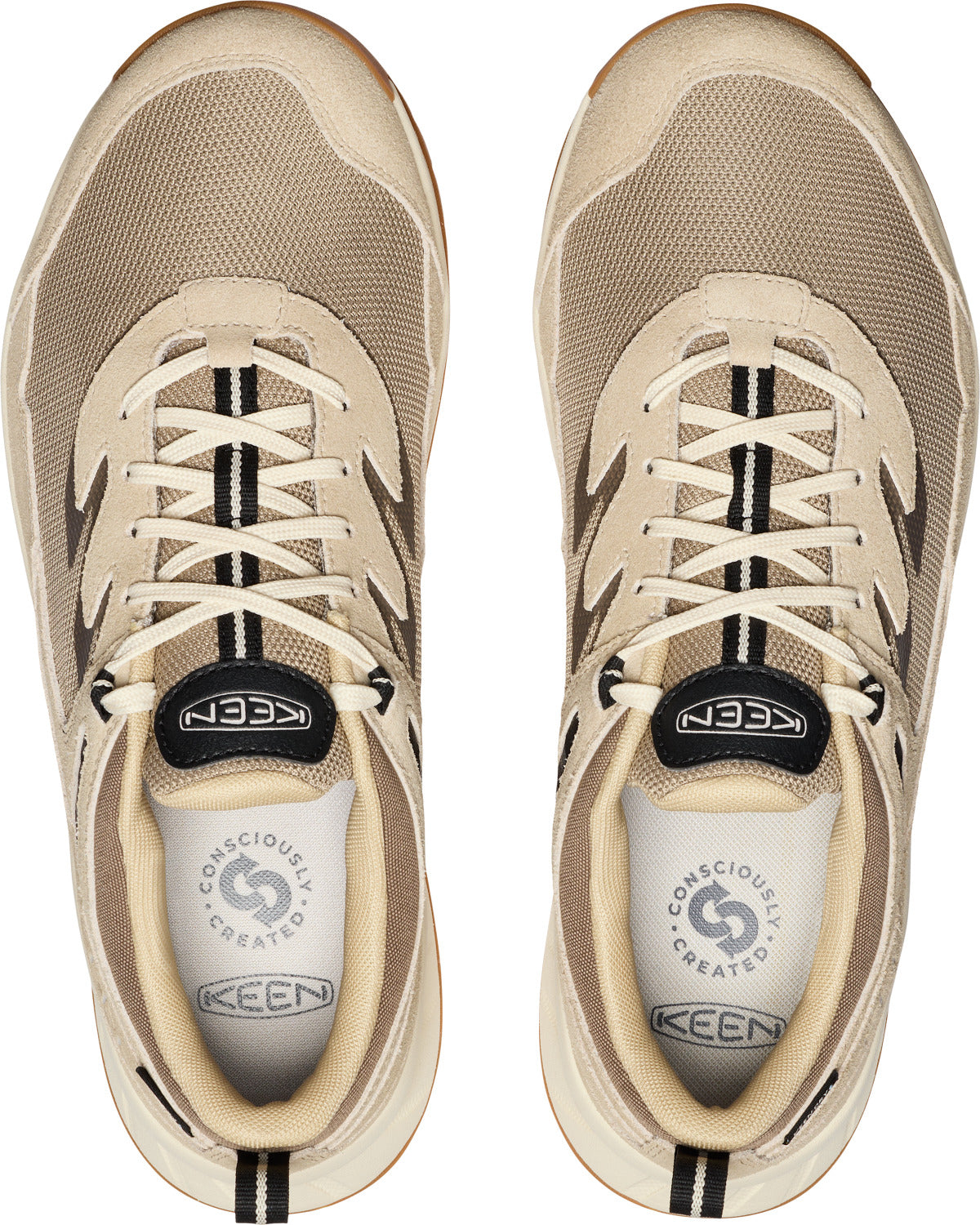Overhead shot of beige KEEN walking shoes with black and white striped laces.