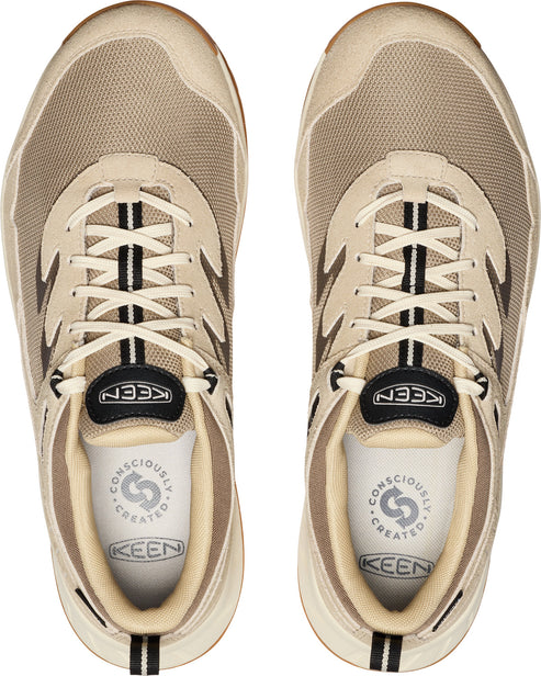 Overhead shot of beige KEEN walking shoes with black and white striped laces.