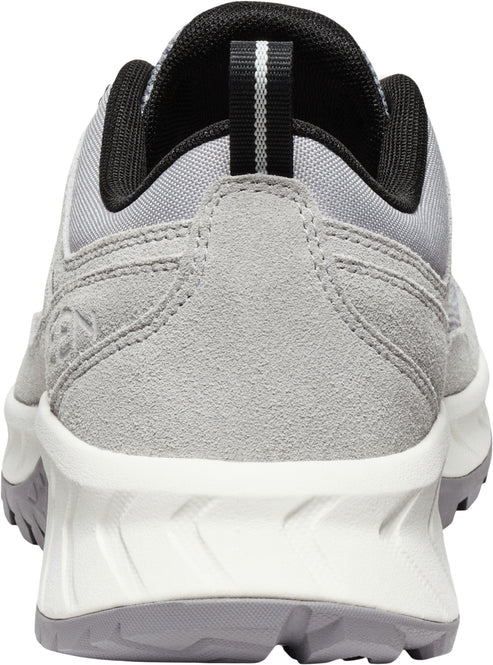 Back of gray suede sneaker with white and gray sole; black interior; heel pull tab.