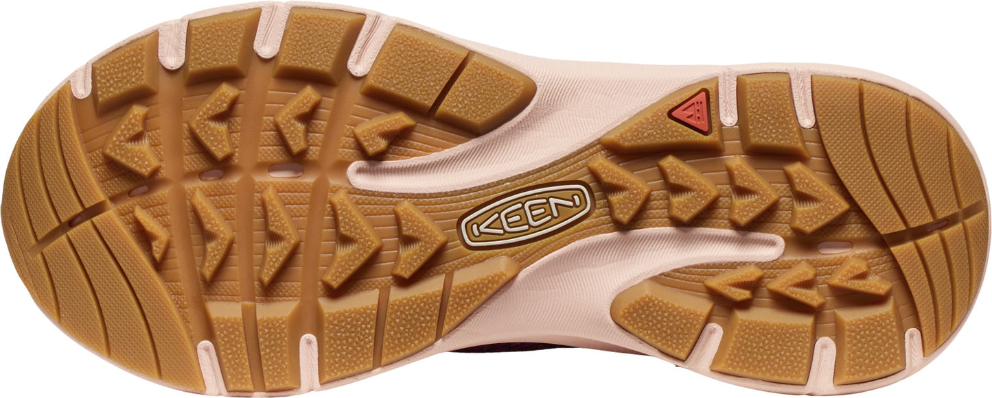 The sole of a shoe, with various arrow shaped and rectangular shaped treads and a KEEN logo.