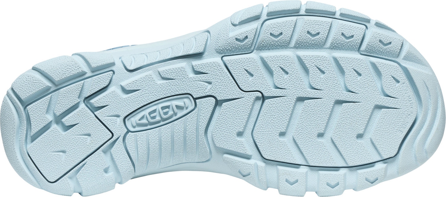 A light blue shoe sole with deep treads and the word KEEN in the middle.