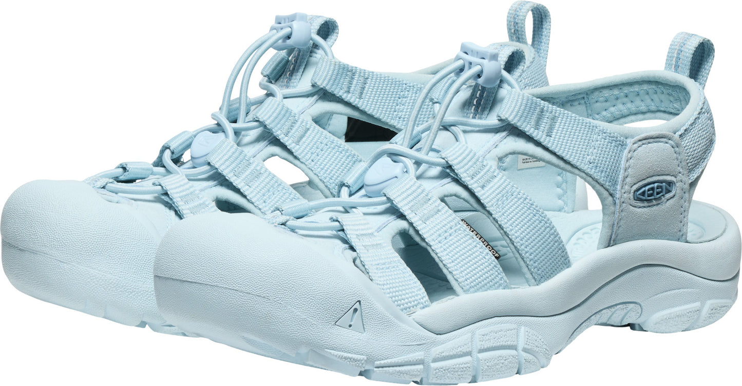 Light blue water sandals with multiple straps and toe protection.