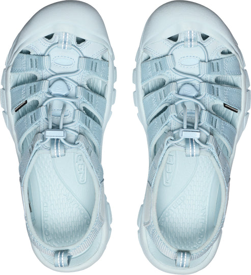 Top-down view of light blue hiking sandals with multiple straps and adjustable bungee closure.