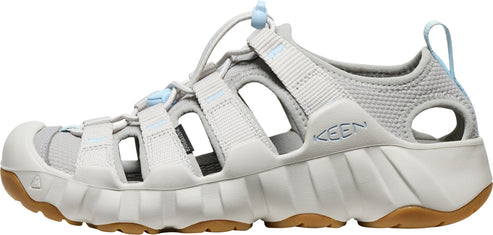 A gray sandal with an open design and brown soles.