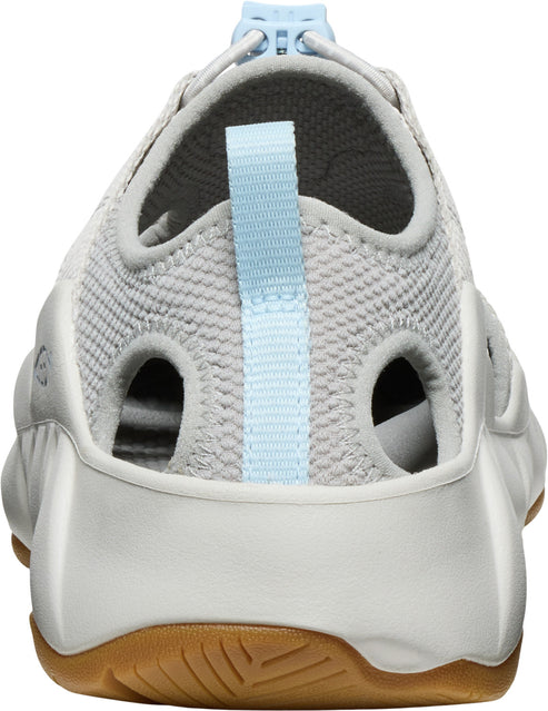Light grey clog style shoe with light blue adjustable strap and openings along the sides and back.