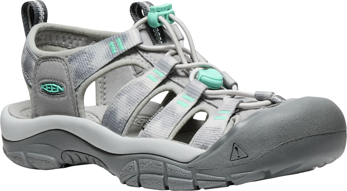 Gray sandal with a closed toe and teal accents.