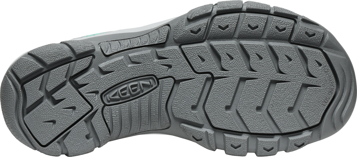 Gray sole of a shoe with the word KEEN.