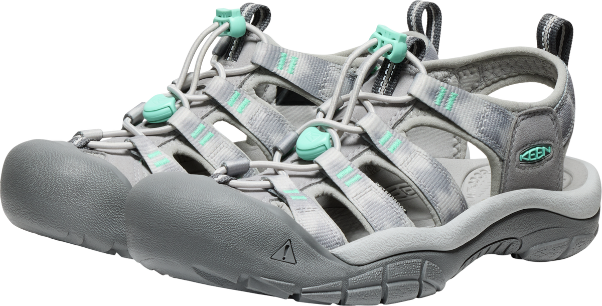 Pair of gray walking sandals with mint green accents and toe protection.