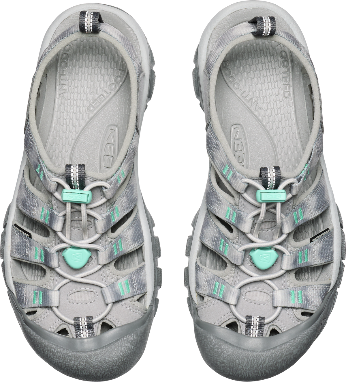 Pair of grey water sandals with aqua accents.