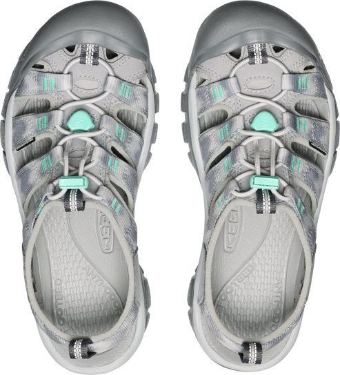 Top-down view of two silver and mint green water sandals with elastic drawstrings.