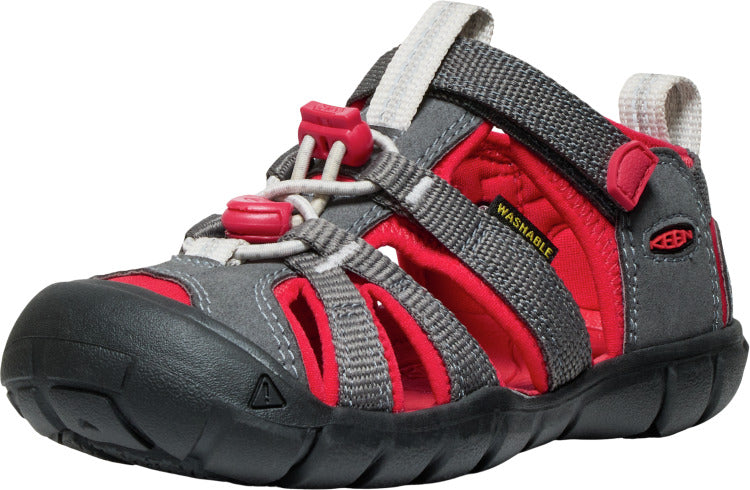 Child's closed-toe sandal with gray fabric straps, a red interior, and a black sole.