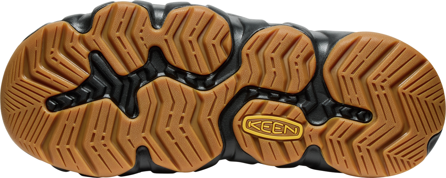 The brown and black patterned sole of a shoe with KEEN branding.
