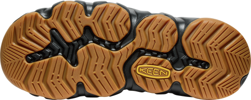 The brown and black patterned sole of a shoe with KEEN branding.