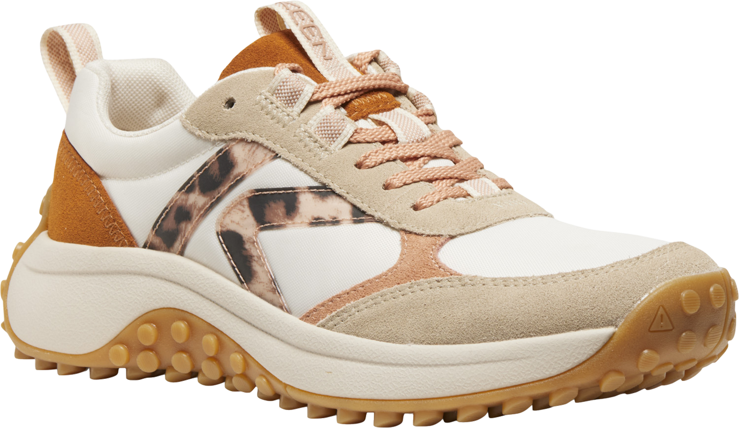A tan and white sneaker with leopard print detailing.