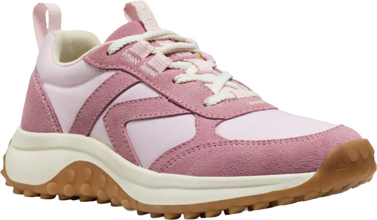 Pink sneaker with suede overlay and a thick beige sole.
