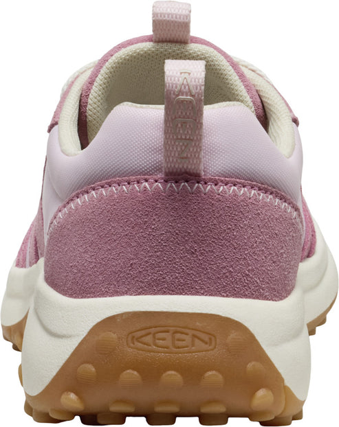 Rear view of a sneaker in various shades of pink with a tan sole and KEEN logo.