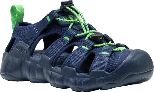 A navy sandal with green bungee-cord-style laces and a rounded toe.