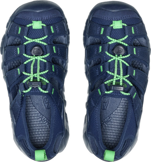 Top-down view of blue sandals with green laces and accents.