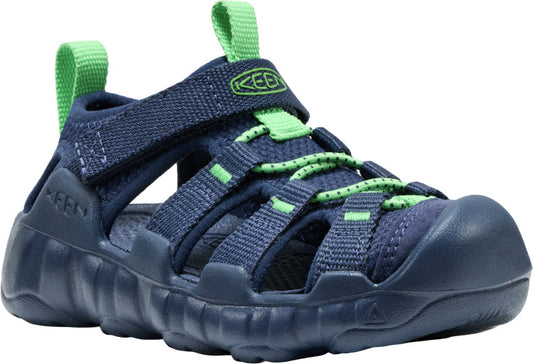 Navy blue sandal with green accents, hook-and-loop strap, and rope laces.