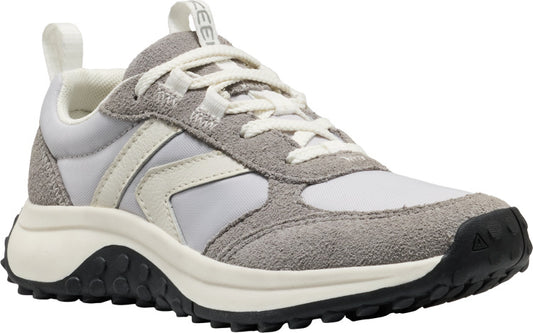 A low-top athletic shoe with gray suede and white nylon panels, white laces, a thick black and off-white sole, and a white heel pull tab.