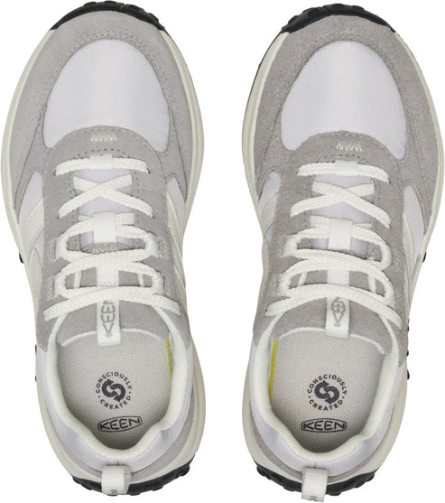 Overhead shot of KEEN sneakers in gray and white with laces, inner soles with text 'Consciously Created', and black soles.
