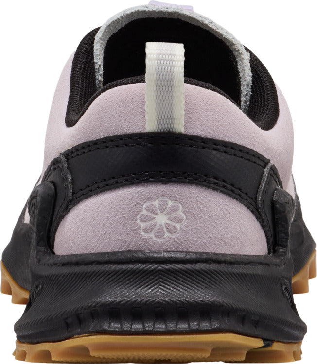 Close-up of lavender, black and gum colored shoe heel with pull tab.