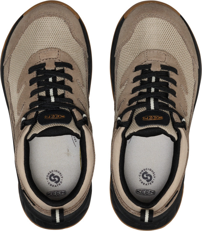 Top-down view of two tan sneakers with black laces and white insoles.