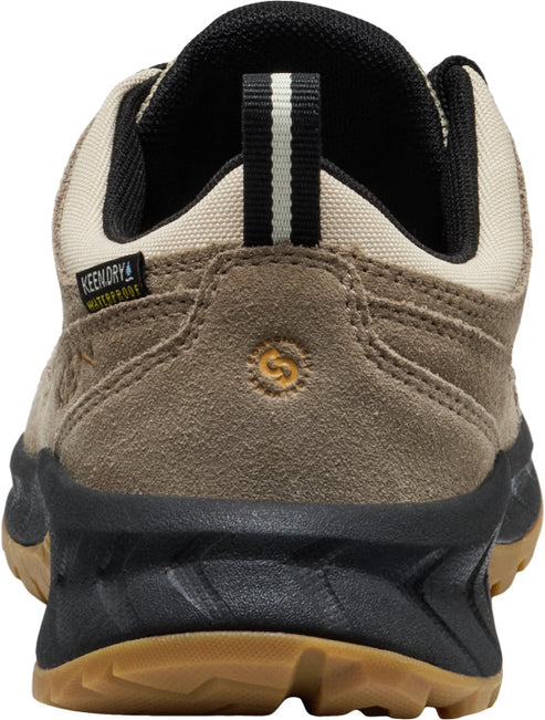 Back view of a tan suede hiking shoe with a KEEN.DRY waterproof label, a black and tan loop, a beige collar, a black sole, and a tan tread.