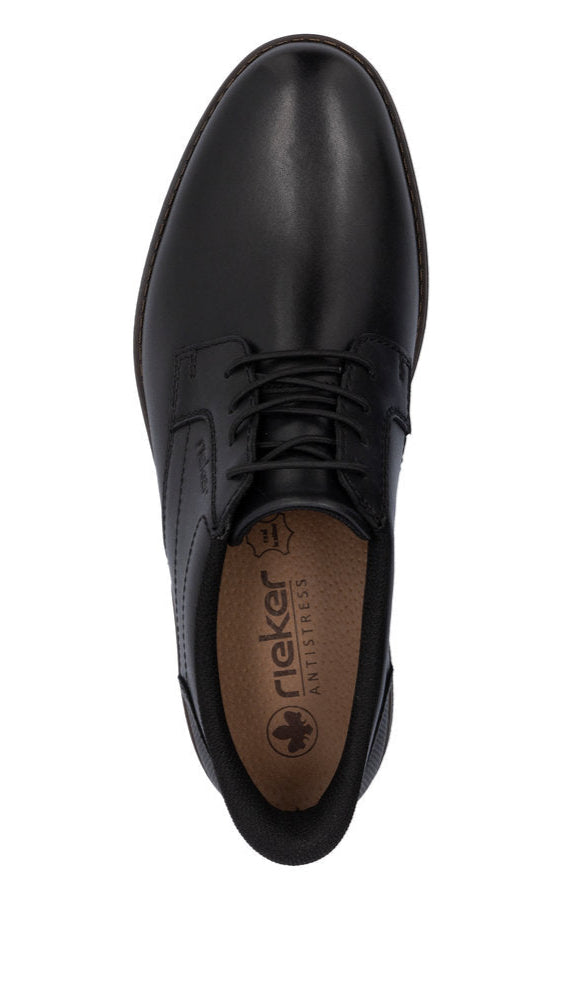 Top-down view of a black leather dress shoe with laces, visible rieker antistress logo on inner sole.