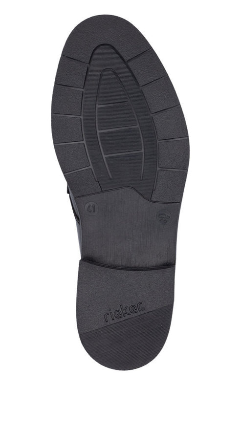 Black shoe outsole with visible size marking and 'rieker' text.