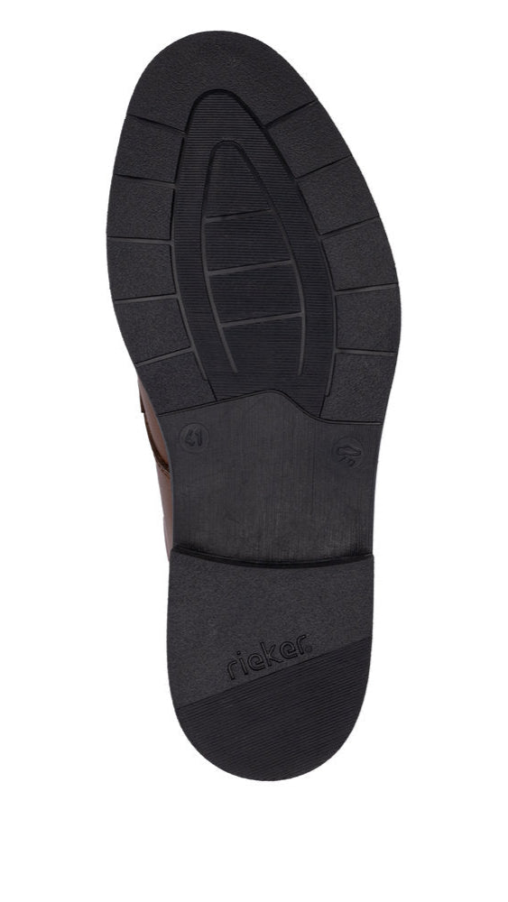 Black shoe sole with tread pattern and the word rieker.