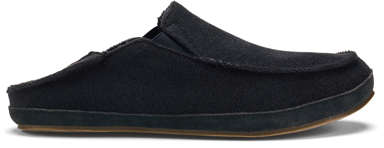 Black slip-on shoe with a brown sole.
