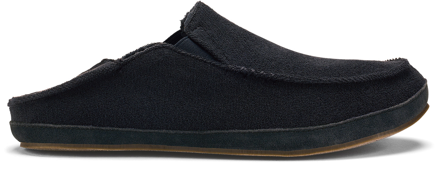 Black slip-on shoe with a brown sole.