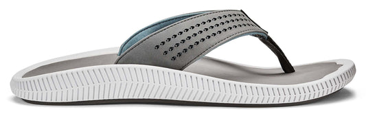 Gray flip-flop with a white sole and rows of small black accents along the upper strap.