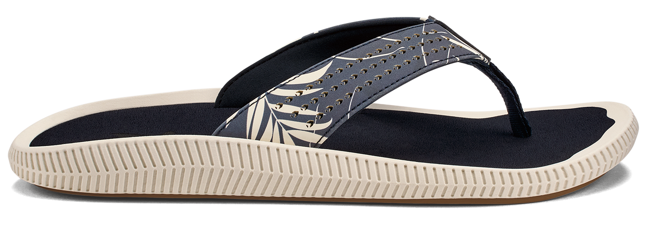 A flip-flop with a decorative patterned strap and a thick, ridged sole.