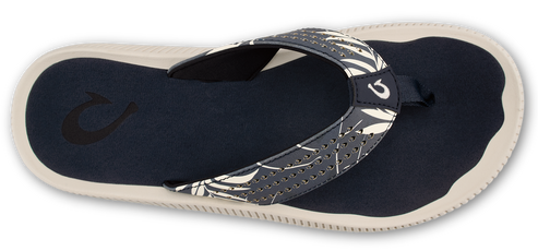 A navy and white patterned flip-flop with a white sole.