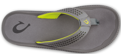 A gray flip-flop with a neon yellow trim and small holes on the strap.