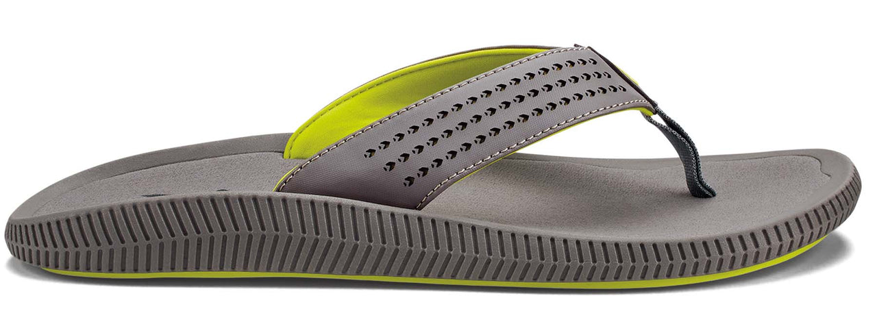 A grey flip-flop with a neon green lining and black toe thong.