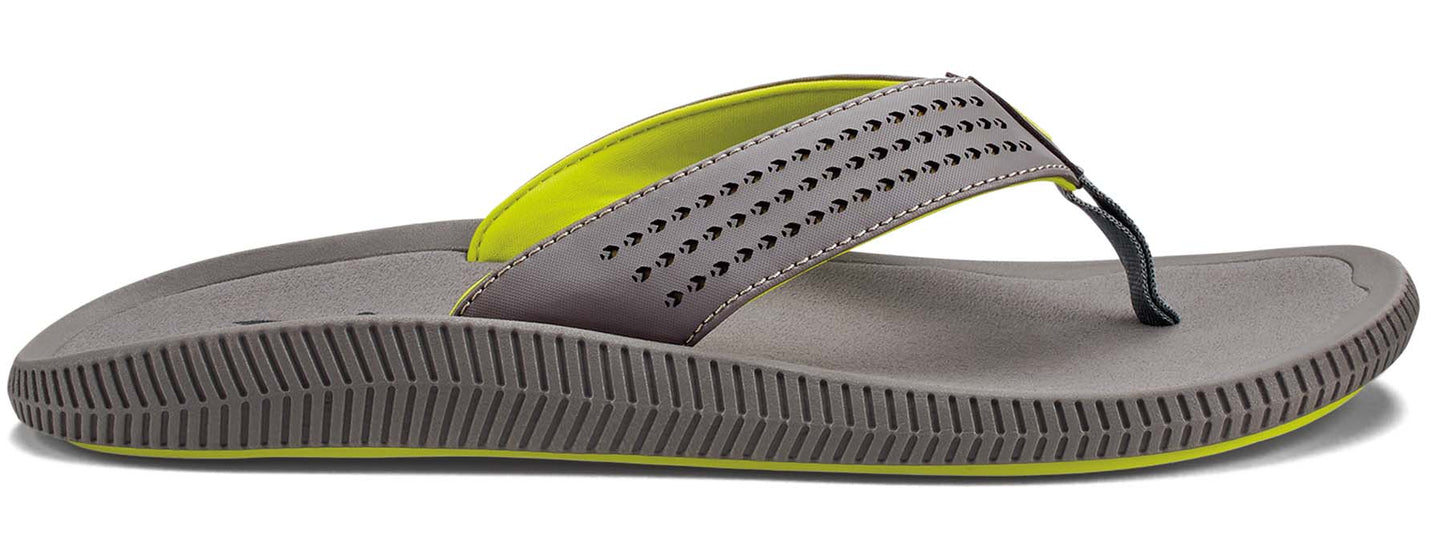 A grey flip-flop with a neon green lining and black toe thong.