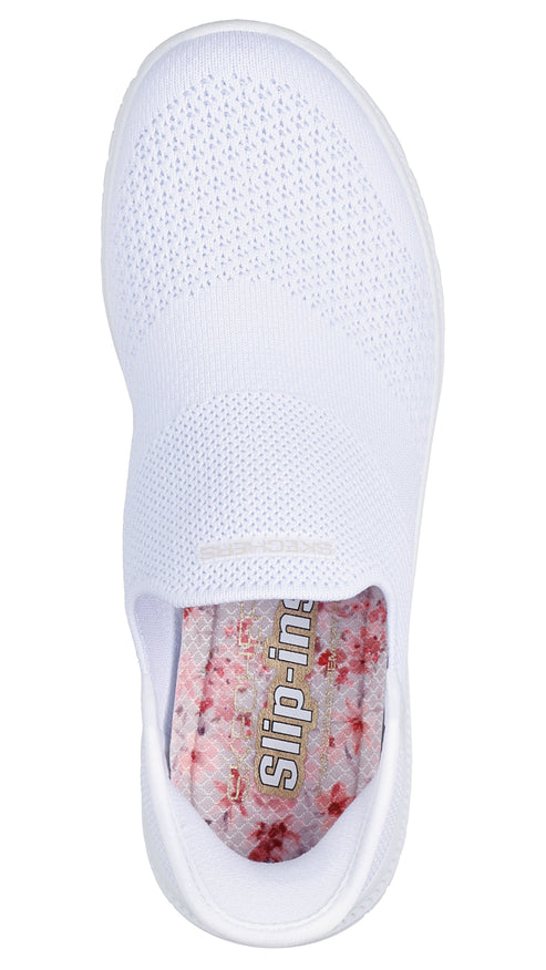 White slip-on shoe with floral-patterned insole.