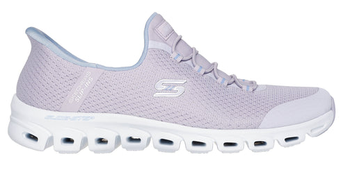 A lilac slip-on sneaker with a white sole that has oval cutouts.